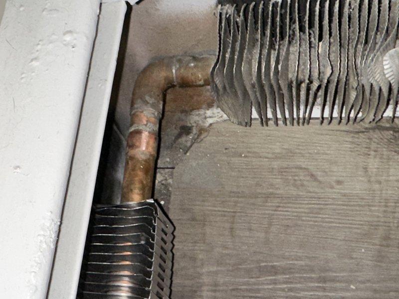 Completed system drain and bleed procedure on HVAC hydronic piping assembly. Utilized ProPress fittings to install replacement components on aged copper piping system with oxidized connections. Addressed air pockets and circulation issues in the heating distribution lines to restore proper system operation and heat transfer efficiency.