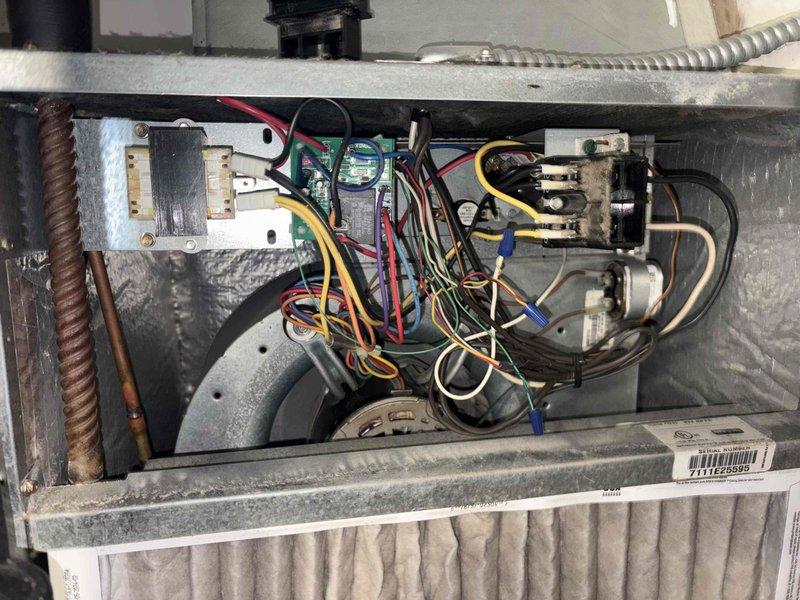 # HVAC Tune-Up Completed

Performed comprehensive air conditioning tune-up on a single outdoor condensing unit located in side yard. Accessed indoor air handler compartment and inspected all electrical components including contactors, relays, capacitors, and wiring connections. Evaluated pleated air filter condition, noting dust accumulation. Verified proper operation of blower motor assembly and examined refrigerant line insulation. All electrical connections, terminal blocks, and control wiring were inspected for secure mounting and proper function to ensure optimal system performance for the cooling season.