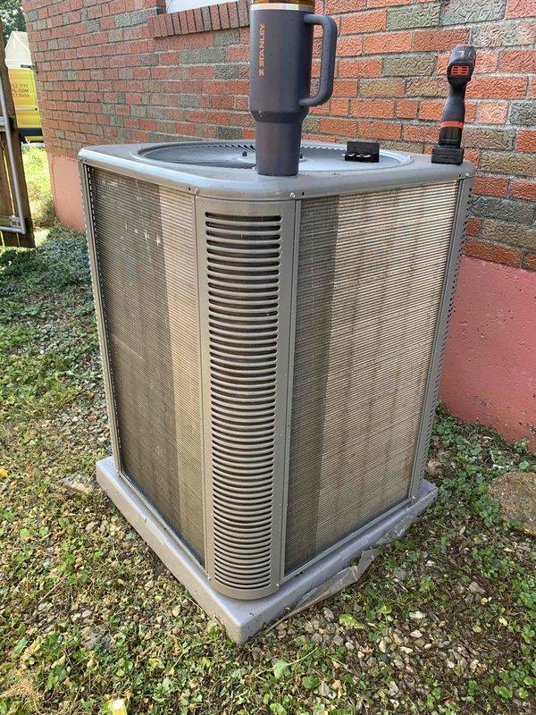 Responded to service call for outdoor condenser unit producing extremely loud noise during startup. Upon inspection of the 24-year-old Carrier unit, diagnosed failing compressor contactor causing excessive arcing and noise during system engagement. Replaced worn contactor, cleaned condenser coils of accumulated debris, and verified proper amperage draw and capacitor function. System now operates quietly with normal startup sequence and continues to provide adequate cooling performance.