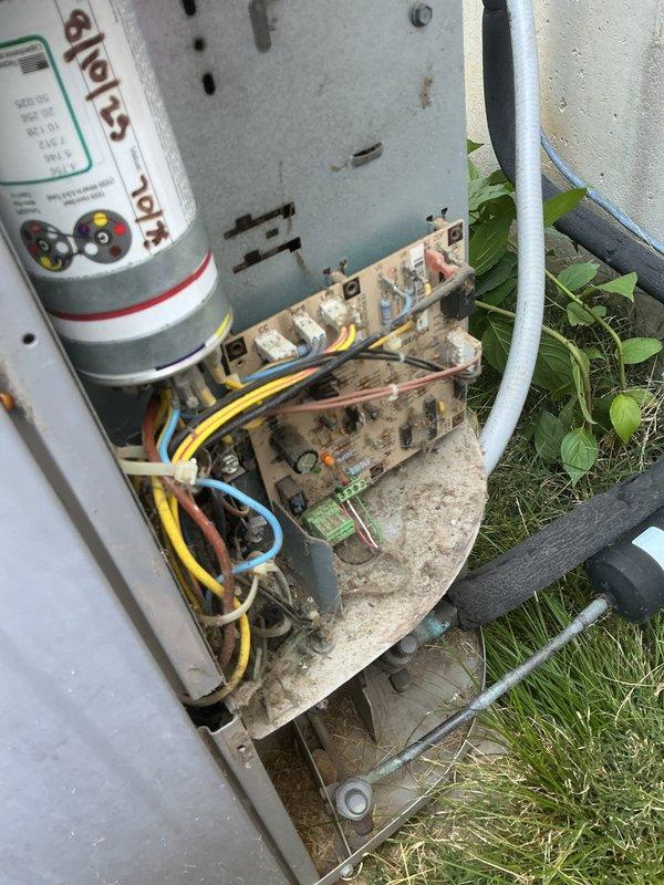 Responded to no cooling call on 19-year-old Carrier system. Upon inspection, found outdoor condenser unit not operating. Removed access panel and discovered heavily soiled control board with significant dirt accumulation and weathering affecting electrical connections. Capacitor showed signs of age but tested within acceptable range. Cleaned control board terminals and verified all wire connections were secure. Inspected indoor components and found condensate drain system functional. Tested system operation after cleaning electrical connections, restored cooling function. Recommended monitoring system performance due to age of equipment and condition of control board. Unit operating normally at time of departure.