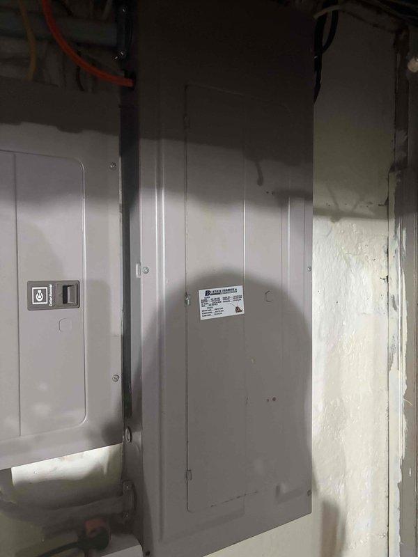 Completed electrical estimate for running power circuit to backyard and installing exterior lighting fixture. Assessed existing electrical panel capacity and service entrance equipment, documented current electrical infrastructure including main distribution panel and utility meter installation. Determined feasible routing path for new circuit installation and confirmed adequate panel capacity for additional load requirements.