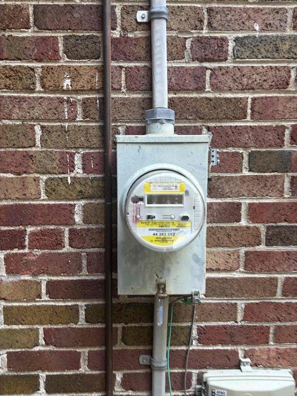 Completed electrical estimate for running power circuit to backyard and installing exterior lighting fixture. Assessed existing electrical panel capacity and service entrance equipment, documented current electrical infrastructure including main distribution panel and utility meter installation. Determined feasible routing path for new circuit installation and confirmed adequate panel capacity for additional load requirements.