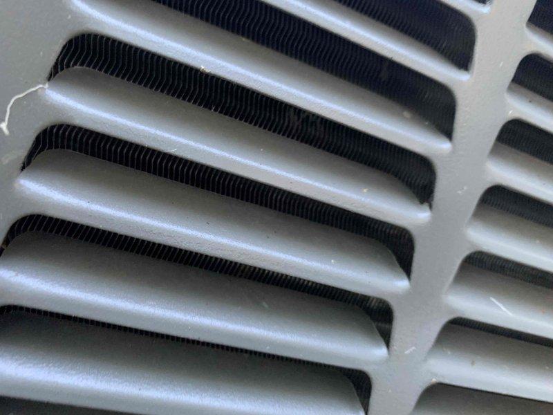 Responded to no cooling complaint on 5-year-old unit located in basement. Upon inspection, found blower motor assembly and evaporator coil in operational condition with no visible damage or debris accumulation. Verified blower wheel intact with proper blade alignment and motor shaft secure. Inspected evaporator coil fins showing good condition with minimal dirt buildup and no signs of refrigerant leakage or frost accumulation. System components photographed for documentation purposes.