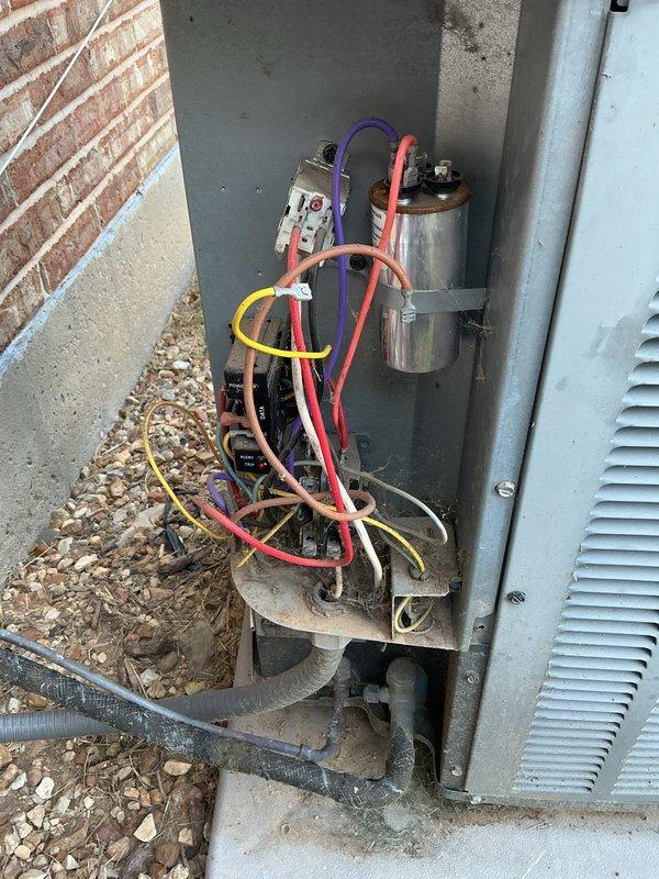 Responded to cooling complaint where system was unable to adequately cool the residence. Upon arrival, performed diagnostic evaluation of outdoor condensing unit. Opened electrical disconnect panel and inspected internal components including contactor, capacitor, and electrical connections. Tested capacitor function and verified proper voltage to unit. Examined refrigerant lines, electrical wiring, and overall system operation to identify root cause of cooling deficiency. Unit was successfully diagnosed and appropriate repairs completed to restore proper cooling performance.