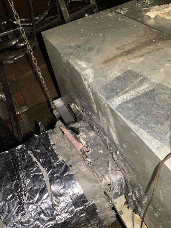 Responded to callback for frozen evaporator coil on HVAC system that was previously repaired. Upon arrival, confirmed unit had been shut off by customer to allow ice buildup to thaw. Inspected air handler unit in attic space, examined refrigerant lines, ductwork connections, and system components for underlying cause of freeze condition. Documented equipment condition with photos showing existing installation, copper line set, flexible ductwork, and cabinet assembly to verify proper thaw-out and assess system for airflow restrictions or refrigerant issues requiring further attention.