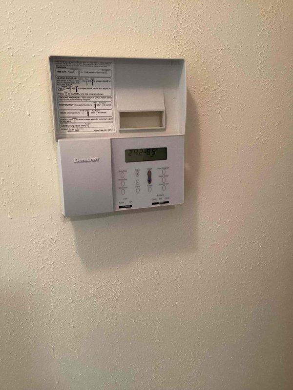 Responded to emergency no cooling call for 8-year-old Trane system affecting entire residence. Upon arrival, inspected Honeywell programmable thermostat and verified settings and display functionality. Proceeded to outdoor condenser unit and performed diagnostic evaluation of the system. Documented equipment condition through photographs of both indoor thermostat and outdoor condensing unit for service records. Unit restored to proper cooling operation and system tested to confirm full functionality throughout the home.