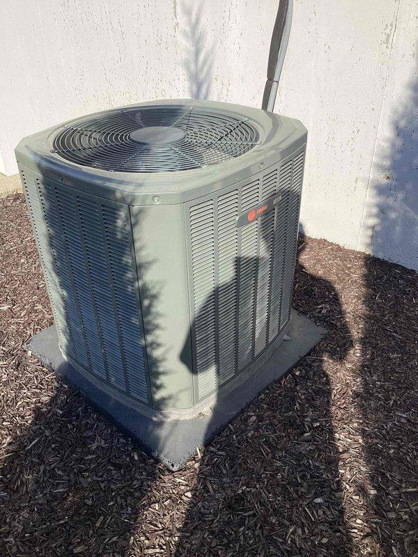 Responded to emergency no cooling call for 8-year-old Trane system affecting entire residence. Upon arrival, inspected Honeywell programmable thermostat and verified settings and display functionality. Proceeded to outdoor condenser unit and performed diagnostic evaluation of the system. Documented equipment condition through photographs of both indoor thermostat and outdoor condensing unit for service records. Unit restored to proper cooling operation and system tested to confirm full functionality throughout the home.