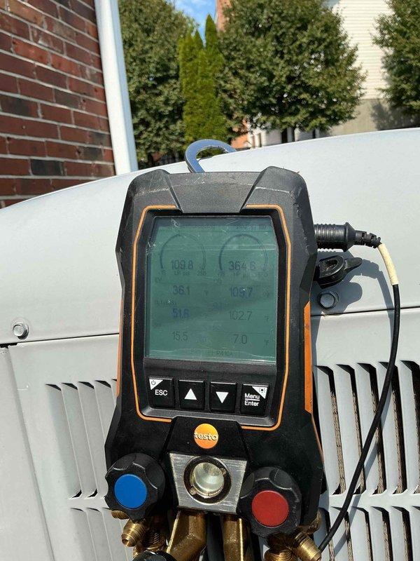 Responded to no cooling complaint on first floor 4-year-old air conditioning system. Upon arrival, verified unit was running but not providing adequate cooling. Performed comprehensive diagnostic evaluation using digital HVAC manifold gauges to measure system pressures and temperatures. Inspected both indoor air handler and outdoor condensing unit. Checked refrigerant levels, compressor operation, and airflow through the system. Documented equipment conditions with photos showing filter location at first floor furnace and diagnostic readings at outdoor unit. Completed troubleshooting procedures to identify root cause of cooling deficiency.