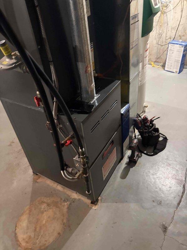 Completed comprehensive heating maintenance tune-up on 15-year-old furnace system. Performed full system inspection including burner assembly, heat exchanger, blower motor, and all safety controls; verified proper operation of humidifier unit and associated ductwork; checked refrigerant lines and electrical connections. System tested and confirmed operating within manufacturer specifications with no deficiencies noted.