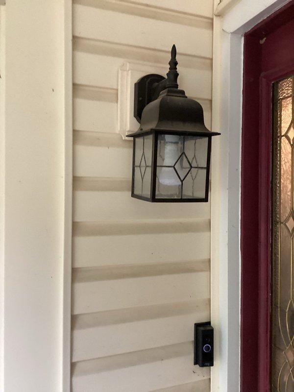 Installed four traditional-style outdoor wall sconces at residential property, including two fixtures mounted to new vinyl siding locations using customer-provided mounting blocks. Completed electrical connections for all four coach-style lanterns with decorative glass panels, ensuring proper wiring, grounding, and weatherproof installation per NEC requirements. Verified proper operation of all fixtures upon completion.