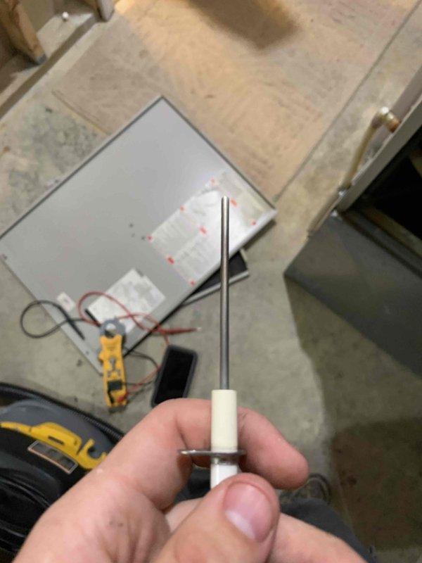 Completed comprehensive tune-up service on two furnace units located in basement. During inspection, identified and replaced faulty flame sensor that was preventing proper ignition cycle. Tested system operation with multimeter to verify proper flame sensing and electrical continuity, confirming both units returned to normal heating operation.