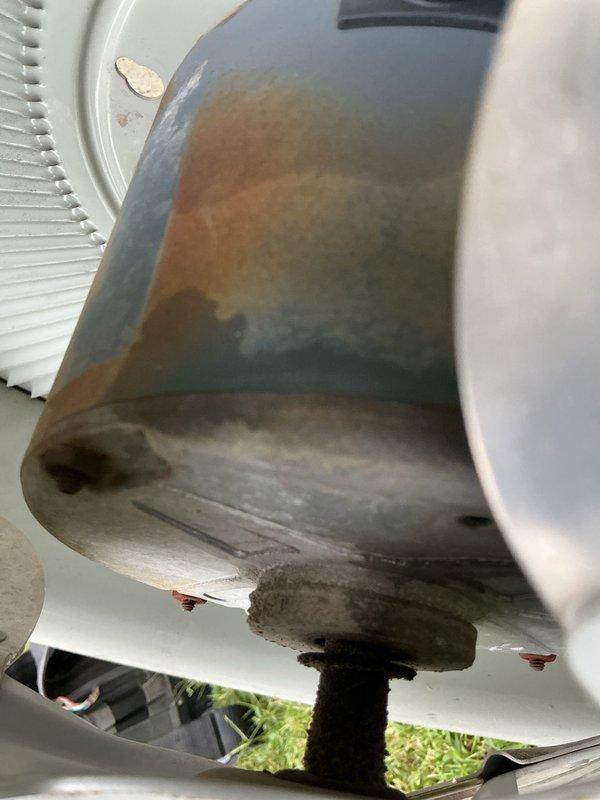 Responded to service call for 20-year-old residential air conditioning system with reported performance concerns. Upon arrival, conducted comprehensive system evaluation including visual inspection of outdoor condensing unit and indoor airflow assessment. Exterior unit examination revealed significant weathering and corrosion on refrigerant line insulation and copper tubing, consistent with age and environmental exposure. Performed temperature differential testing at supply register using digital thermometer to measure cooling output and verify system performance. Documented equipment condition through photographic evidence showing advanced deterioration of outdoor components and conducted operational testing of indoor air delivery. Advised customer of system age and observed wear patterns indicating potential need for future component replacement or full system upgrade.
