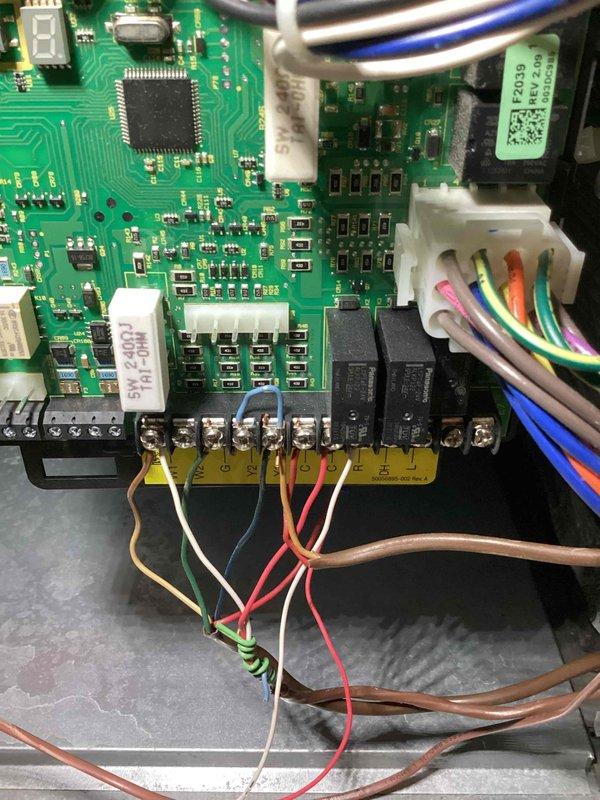 Replaced defective ECM motor control board under warranty to restore cooling operation to HVAC system. Removed failed control board (S/N 5921D06018) and installed new replacement unit, reconnecting all wire harnesses and terminal connections to terminal block. Verified proper electrical connections, tested system operation, and retained original defective part per warranty requirements.