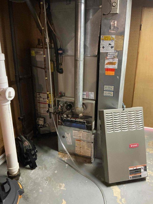 Completed comprehensive tune-up service on two HVAC units: one Bryant furnace located in basement and one air conditioning unit positioned at side of home, both approximately 10 years old. Performed full system inspection, cleaned and tested all components, verified electrical connections and control board operation, checked refrigerant levels, inspected ductwork and ventilation systems, and confirmed proper operation of both heating and cooling equipment.