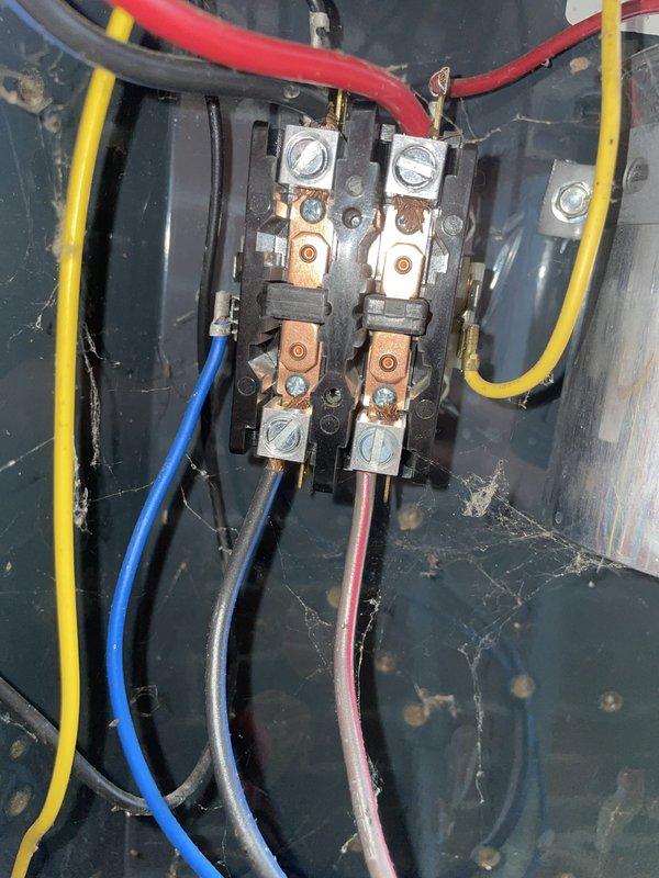 Responded to no cooling complaint with ice formation on unit U10 located at back of home. Upon arrival, instructed occupant to turn off AC unit while leaving fan in ON position to allow ice to thaw. Inspected electrical control panel and contactor assembly, documenting existing wiring connections and component conditions. Observed aged HVAC system with visible wear on electrical enclosure and components, including oxidation on terminal connections. Capacitor and contactor assembly inspected and photographed for service records. System shows signs of extended service life with weathered components throughout electrical compartment.