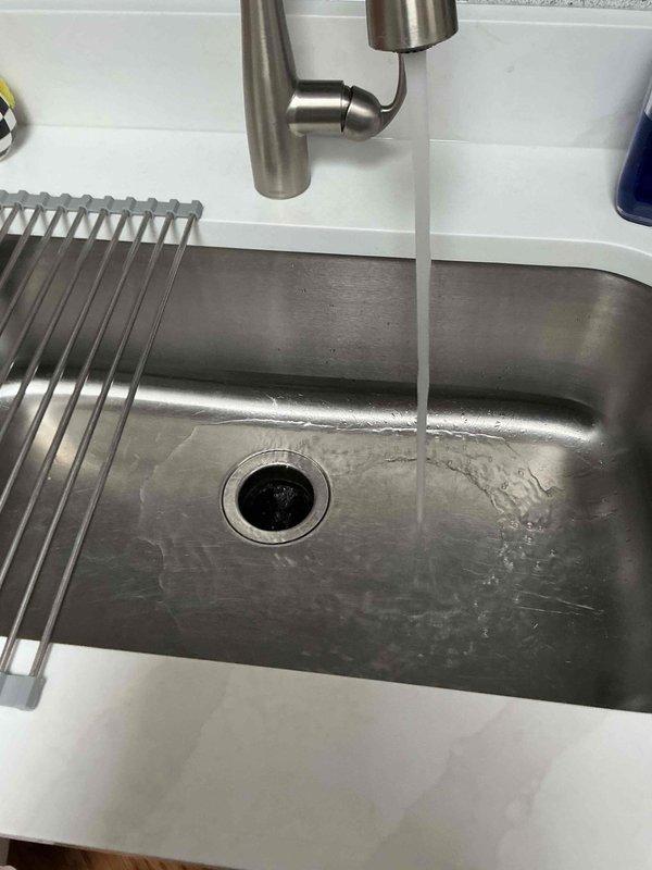 Responded to kitchen sink clog complaint. Upon arrival, inspected the kitchen sink drainage system and surrounding plumbing fixtures. Cleared the obstruction from the kitchen sink drain using appropriate tools and techniques. Verified proper water flow and drainage function. Sink is now draining properly with no backup or slow drainage issues observed.