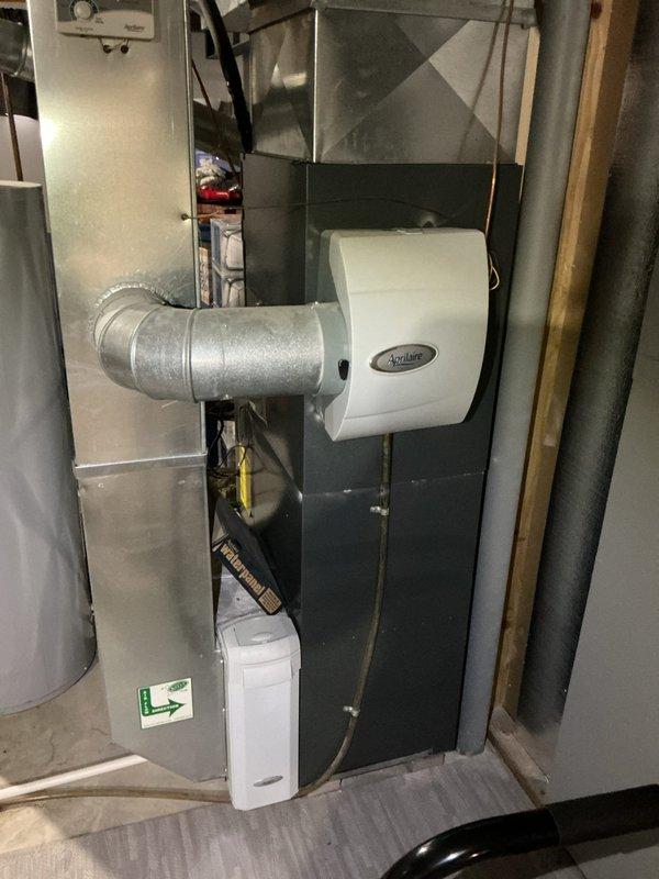 Completed comprehensive tune-up maintenance on a basement-installed furnace unit equipped with an Aprilaire humidifier. Performed standard inspection of all system components, ductwork connections, and ventilation pathways to ensure proper operation and efficiency. All equipment found to be in functional condition with no immediate repairs required at this time.