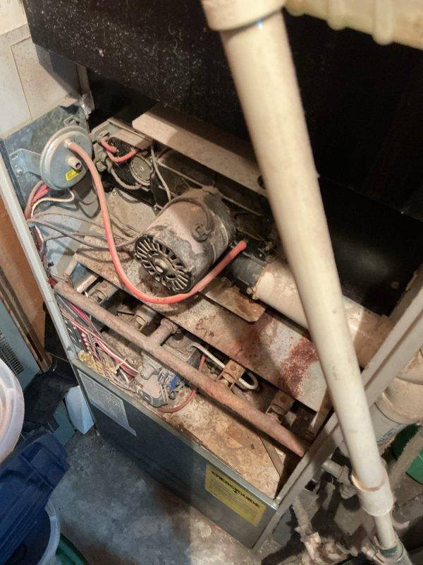 Completed comprehensive tune-up and maintenance service on a single outdoor cooling unit located in side yard. Performed standard inspection of all major components including compressor, condenser coils, electrical connections, and refrigerant levels. Noted significant age-related deterioration with heavy rust formation on internal components and substantial dust accumulation throughout the system, indicating extended service life without recent maintenance. Observed that outside disconnect box shows signs of weathering and may require replacement in the near future to ensure safe operation and proper electrical disconnection capability.