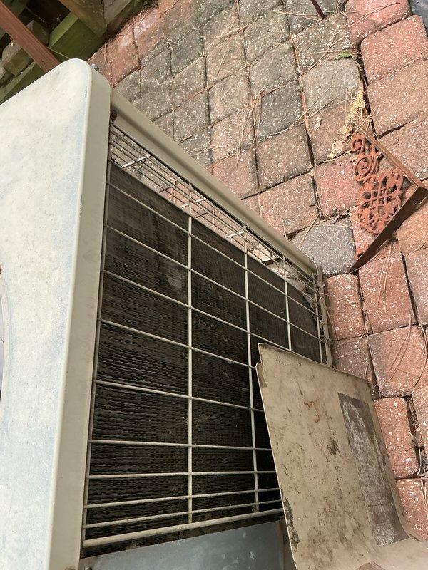 Completed comprehensive tune-up and maintenance service on a single outdoor cooling unit located in side yard. Performed standard inspection of all major components including compressor, condenser coils, electrical connections, and refrigerant levels. Noted significant age-related deterioration with heavy rust formation on internal components and substantial dust accumulation throughout the system, indicating extended service life without recent maintenance. Observed that outside disconnect box shows signs of weathering and may require replacement in the near future to ensure safe operation and proper electrical disconnection capability.