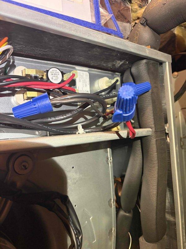 Responded to service call for non-operational upstairs HVAC system installed in July. Upon arrival, inspected 1970s-era fuse panel that had previously failed approximately one month ago requiring fuse replacement. Conducted comprehensive assessment of electrical panel condition, connections, and capacity to support newly installed heating and cooling equipment. Examined all circuit breakers, fuses, and wire terminations for signs of deterioration, overheating, or inadequate amperage rating. Photographed existing panel configuration showing aged wiring, multiple circuit connections, and overall panel condition. Inspected HVAC equipment electrical connections including capacitor, control wiring, and power supply terminations to verify proper installation and identify any contributing factors to system failure. Evaluated whether existing electrical infrastructure meets current code requirements and has sufficient capacity to reliably operate new HVAC system without repeated outages. Based