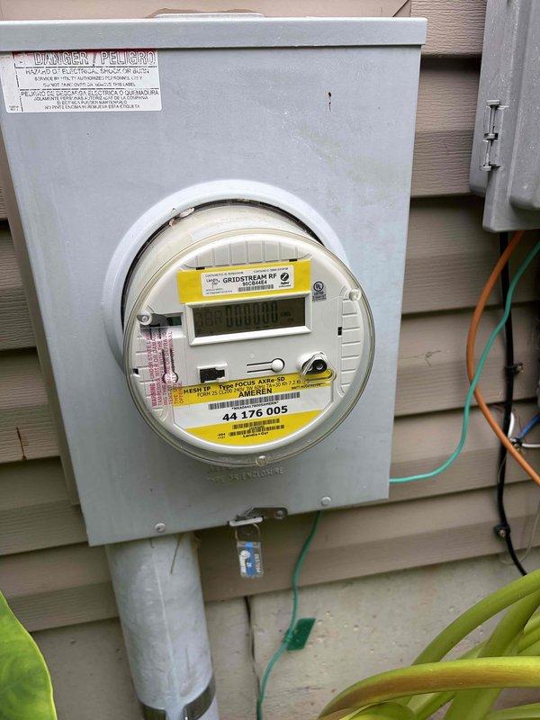 Responded to service call for flickering kitchen light fixture. Conducted comprehensive electrical home audit, inspecting main electrical panel, service meter, and associated wiring systems. Documented electrical infrastructure including panel box with multi-conductor wiring, exterior meter installation with proper conduit routing, and ground wire connections. All critical electrical components photographed for service records.