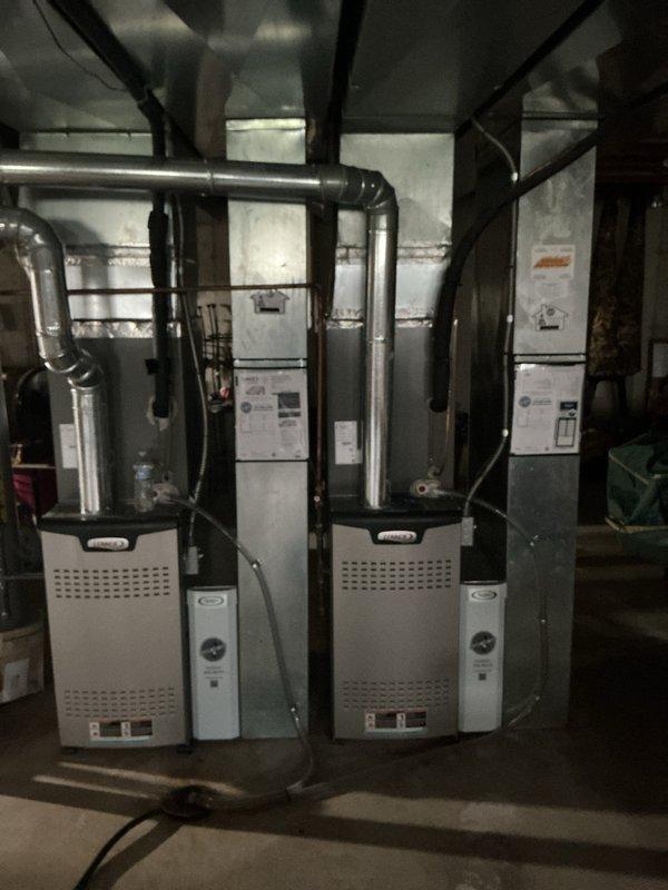 Completed comprehensive Supertune maintenance on two HVAC furnace units located in basement mechanical room. Performed full system inspection, cleaned and tested all components, verified proper airflow through heat exchangers, checked electrical connections and controls, inspected and cleared condensate drainage systems, tested safety switches and limit controls, measured temperature rise across heat exchangers, and confirmed proper thermostat operation displaying 79°F. Both units operating within manufacturer specifications with no issues identified.