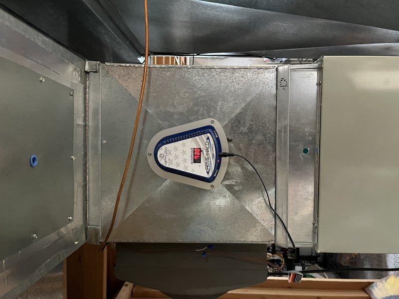 Successfully installed REME HALO air purification system into existing HVAC air handler unit. Unit was mounted to interior wall of air handling system with proper electrical connection established, and system was tested to ensure proper operation. The air purification device is now actively treating air as it circulates through the HVAC system.