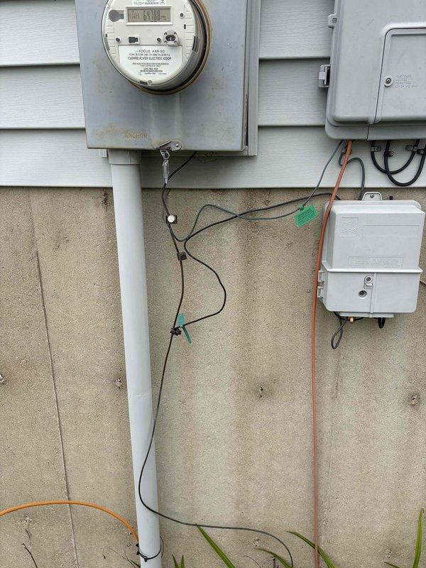 Responded to customer report of flickering and dimming lights occurring when high-draw appliances such as microwave, air fryer, air conditioning unit, and washing machine were in operation. Performed comprehensive electrical system inspection including visual examination of main service panel, metering equipment, and garage electrical components. Assessed voltage stability and circuit loading conditions to identify potential causes of power fluctuations affecting lighting circuits throughout the residence.