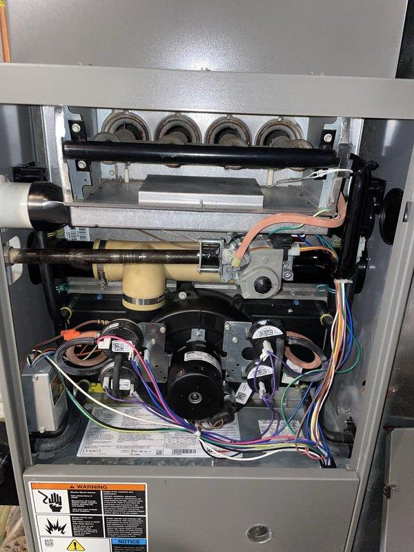 Completed installation of new inducer motor and replaced burner assembly on residential gas furnace. Removed old burners showing signs of wear and corrosion, installed new burner assembly with proper alignment to heat exchanger ports. Verified all electrical connections to new inducer motor, tested unit operation through complete heating cycle, and confirmed proper ignition sequence and flame characteristics across all burners. System returned to full operational status with heat functionality restored.