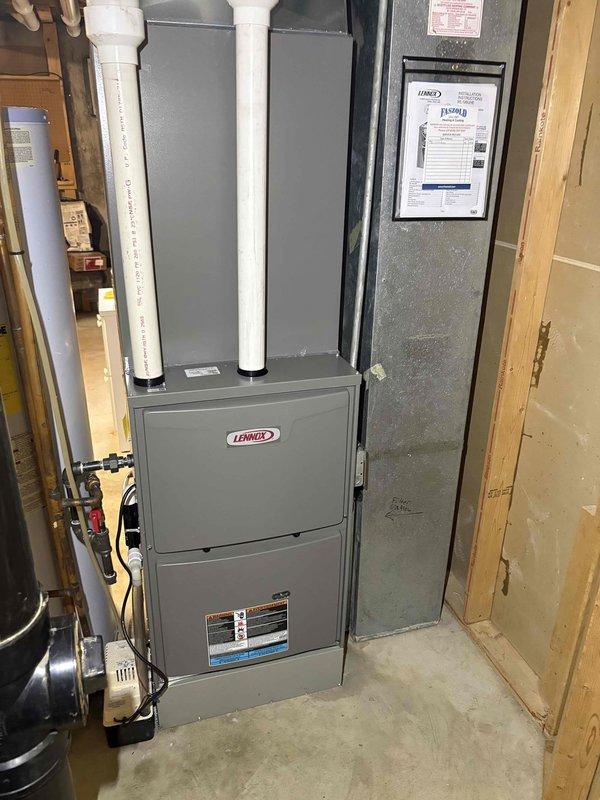 Completed comprehensive heating tune-up on Lennox furnace system located in basement mechanical room. Performed standard maintenance protocol including inspection of heat exchanger, burner assembly, and venting system with dual PVC intake/exhaust configuration. Serviced humidifier unit as requested, checking water supply, drainage, and operational settings. Verified thermostat operation and system cycling, confirming proper communication between Sensi digital control and furnace. All components found operating within manufacturer specifications with no deficiencies noted. System tested and left in proper working order.