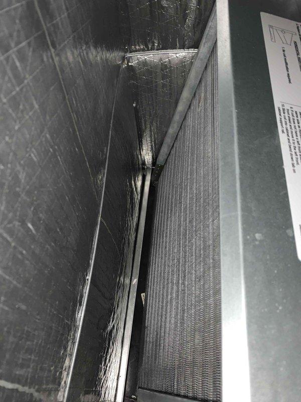 Completed comprehensive tune-up service on a 10-year-old residential air conditioning unit located in side yard. Performed standard maintenance protocol including system inspection, filter evaluation, and component assessment. Documented equipment condition with photos showing air filter housing and installed pleated filter in acceptable operating condition.