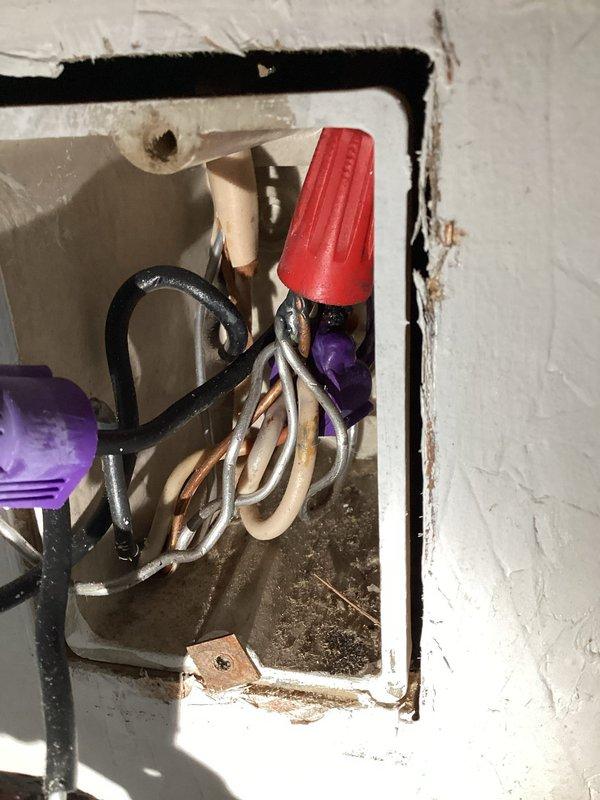 Completed electrical service call involving estimate and troubleshooting work for installation of 10 new circuit breakers in the electrical panel. Assessed existing junction box wiring configurations, documented multiple wire connections secured with appropriate wire nuts, and verified proper wire bundling and grounding connections within wall-mounted electrical boxes.
