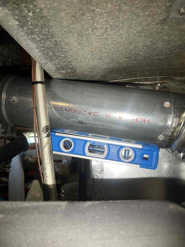 Replaced defective flue pipe assembly on HVAC system. Installed two 4-inch 90-degree elbows and two straight pipe sections to restore proper venting. Verified proper pitch and alignment using level, ensured secure connections at all joints, and removed old components from site. System tested and confirmed operational with proper heat function.