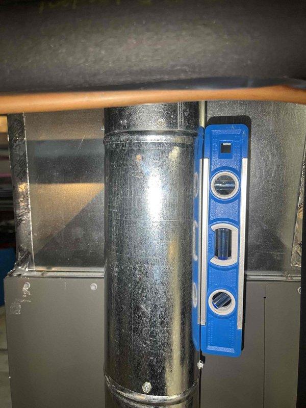Replaced defective flue pipe assembly on HVAC system. Installed two 4-inch 90-degree elbows and two straight pipe sections to restore proper venting. Verified proper pitch and alignment using level, ensured secure connections at all joints, and removed old components from site. System tested and confirmed operational with proper heat function.