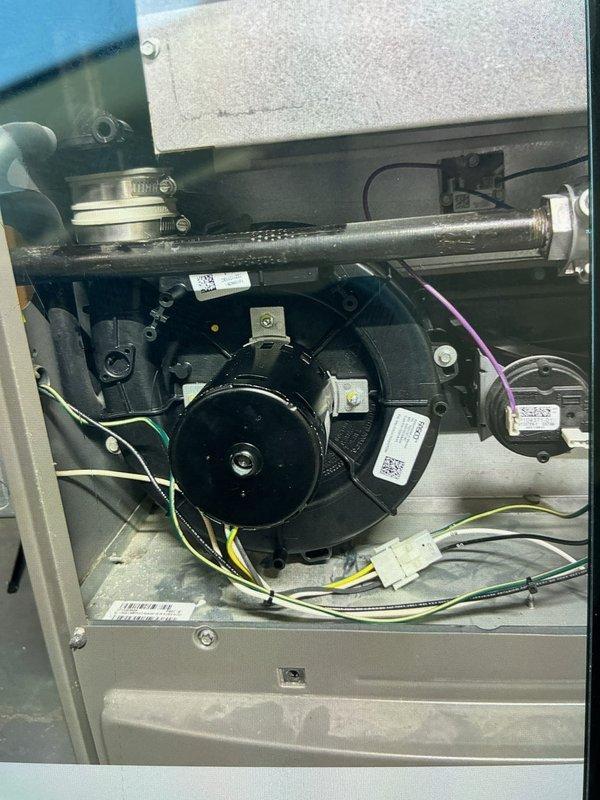 Responded to no heat call and replaced defective inducer motor under warranty on furnace system. Removed failed motor assembly from blower housing, installed new replacement unit (S/N 1719J23604), reconnected all electrical connections, and verified proper operation. Retained original part per warranty requirements and confirmed system restored to normal heating operation.