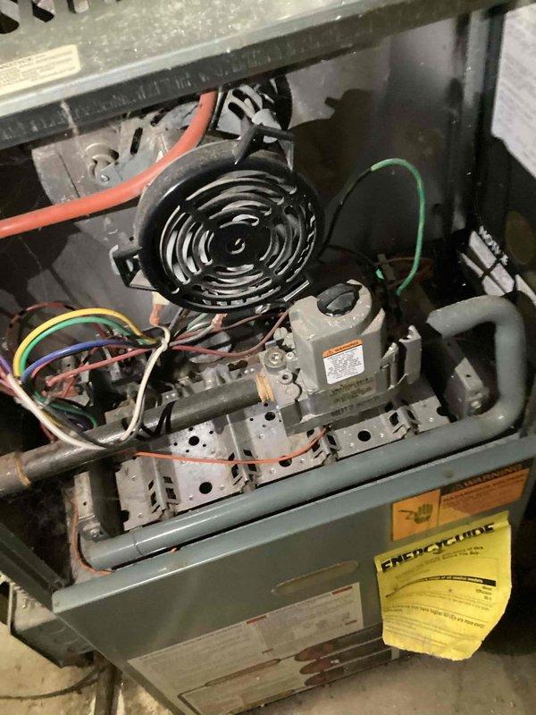 Completed comprehensive heating tune-up and safety inspection on 25-year-old gas furnace unit. Performed full system evaluation including blower motor assembly, heat exchanger inspection through visual examination of combustion chamber and burner components, verified gas valve operation, checked all electrical connections and wiring throughout the unit, and confirmed proper airflow through the system. All components found operational with unit returning to normal heating service.