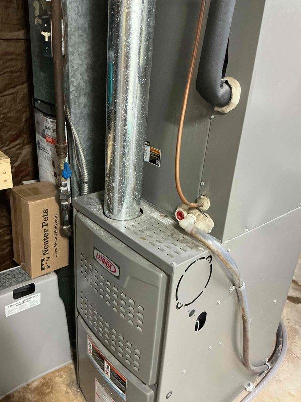 Completed comprehensive U10 Supertune maintenance on two HVAC units: one outdoor AC unit located at side of home and one Lennox furnace system in basement. Performed full system inspection, replaced dirty air filter showing significant dust accumulation, checked refrigerant lines and ductwork for proper operation, and verified all components functioning within manufacturer specifications.