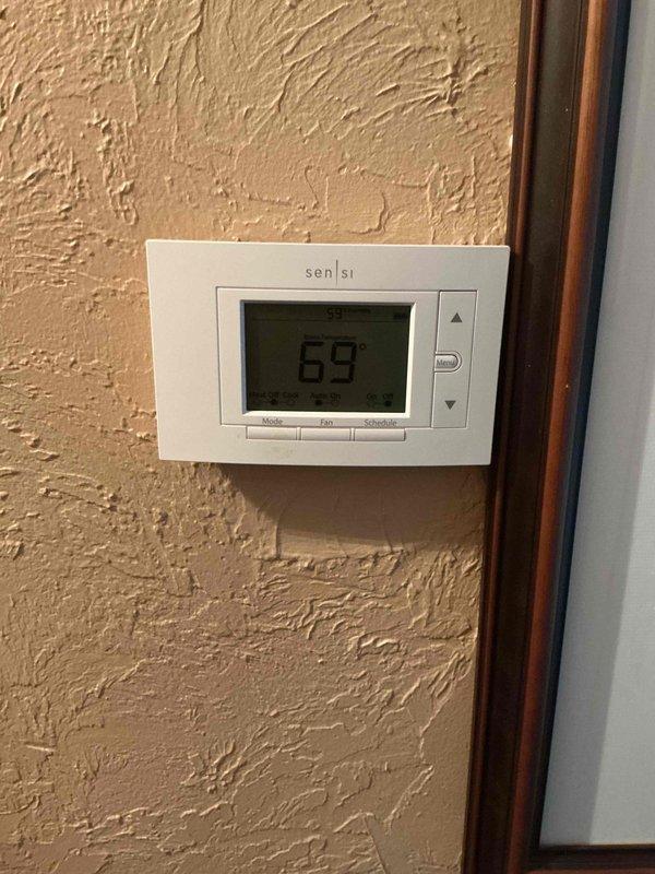 Completed annual heating maintenance tune-up on residential gas furnace system. Performed comprehensive inspection of furnace components, tested thermostat operation and calibration, checked all electrical connections, verified proper airflow, inspected heat exchanger for cracks or damage, tested safety controls and limit switches, cleaned burner assembly, checked gas pressure and combustion efficiency, inspected venting system, and replaced air filter. System found operating within manufacturer specifications with no deficiencies noted; thermostat maintaining proper temperature control at 69°F setpoint.