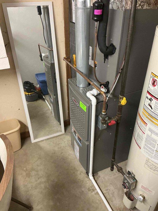 Completed annual heating maintenance tune-up on residential gas furnace system. Performed comprehensive inspection of furnace components, tested thermostat operation and calibration, checked all electrical connections, verified proper airflow, inspected heat exchanger for cracks or damage, tested safety controls and limit switches, cleaned burner assembly, checked gas pressure and combustion efficiency, inspected venting system, and replaced air filter. System found operating within manufacturer specifications with no deficiencies noted; thermostat maintaining proper temperature control at 69°F setpoint.