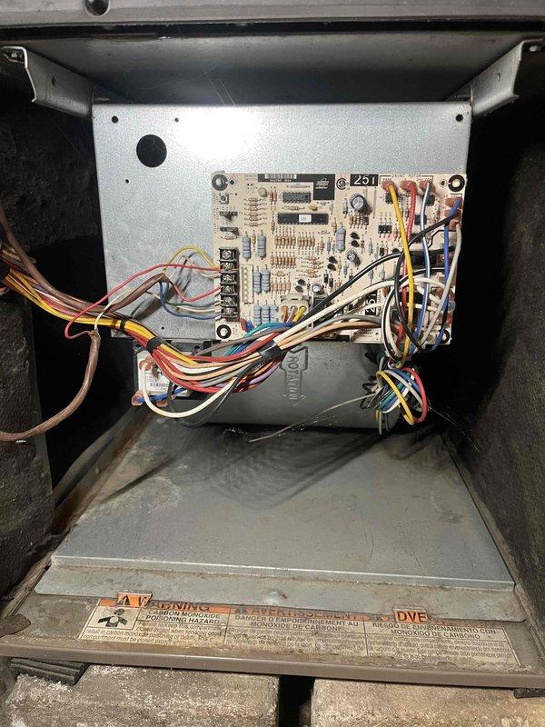 Completed comprehensive tune-up service on basement furnace unit as part of Home Depot promotional maintenance program. Performed full system inspection including blower motor assembly, gas valve operation, control board functionality, and all electrical connections. Verified proper operation of all safety controls, cleaned accessible components, and documented system condition with interior compartment photography showing blower assembly, circuit board, and wiring harnesses in satisfactory working order.