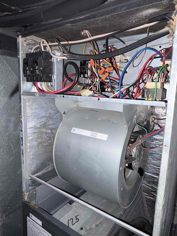 Completed routine preventative maintenance and tune-up on residential air conditioning system per customer request. Performed comprehensive inspection of air handler unit, including blower motor assembly, electrical connections, control board, and capacitor components. Inspected and evaluated air filter condition, noting dust accumulation. All electrical connections, wiring, and components found secure and functioning properly with no deficiencies observed. System operating within normal parameters at time of service completion.
