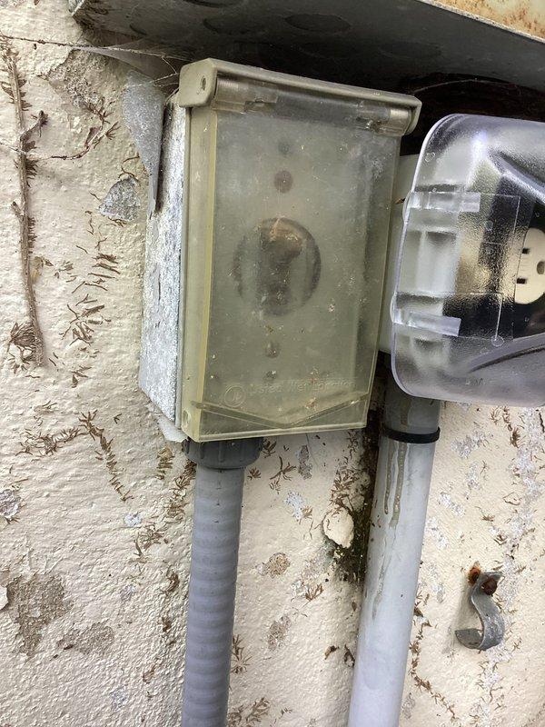 Responded to follow-up service call for pool electrical system issues. Adjusted and secured outlet boxes in the pool area that had become misaligned. Replaced damaged electrical conduit casing and junction box components showing significant weathering and deterioration. Inspected exterior electrical installations including meter enclosure, conduit runs, and associated wiring connections. Verified proper grounding and secure mounting of all electrical fixtures. Documented existing conditions including aged stucco surface, deteriorated protective covers on junction boxes, and gray flexible conduit connections to pool pump system. All electrical components tested and confirmed operational upon completion.