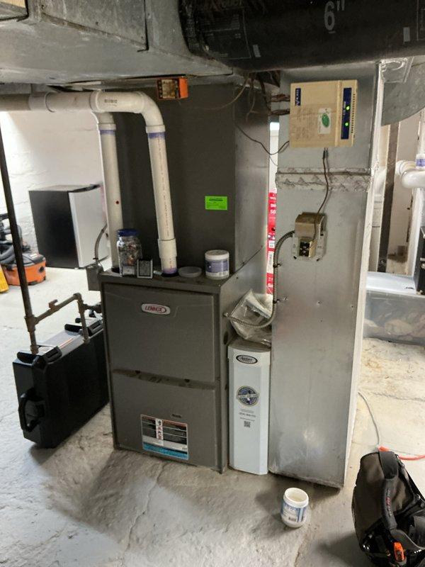 Completed heating tune-up and preventative maintenance on Lennox furnace unit located in basement mechanical room. Performed standard inspection procedures, checked all electrical connections and control components, and installed clean air filter in system. All equipment found operating within normal parameters with no immediate service concerns identified.