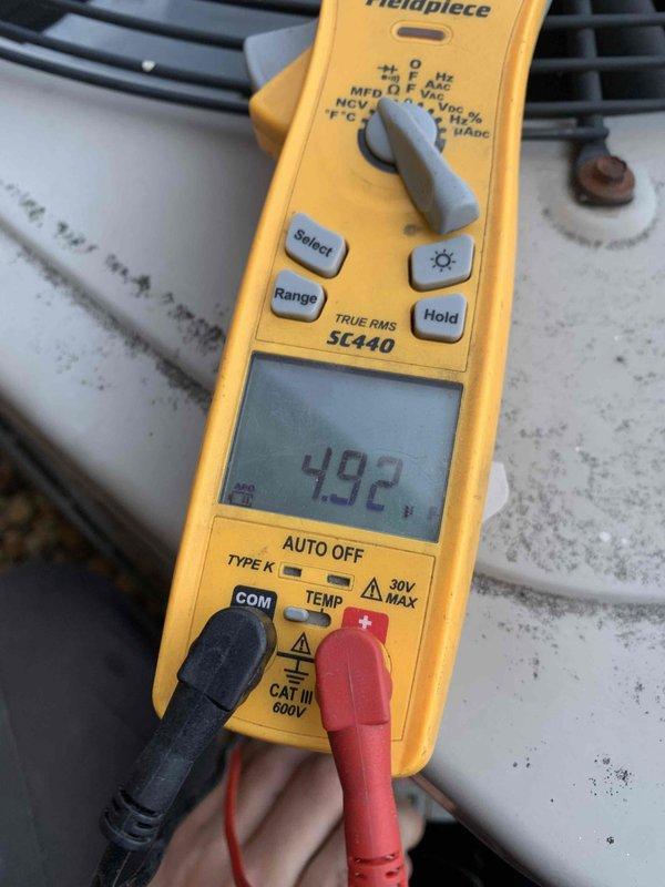 Completed comprehensive AC tune-up and preventative maintenance on 10-year-old residential cooling system. Performed full system inspection including blower motor assembly evaluation, electrical testing with multimeter showing 4.92 amp draw within normal operating parameters, and verified all mechanical components functioning properly. System operating efficiently with no deficiencies noted at time of service.