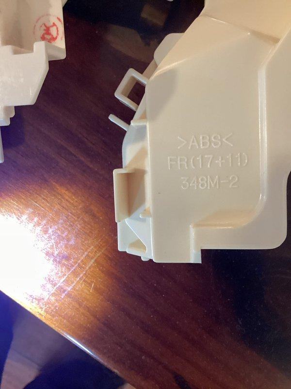 Responded to service call for squeaking mini split system. Upon inspection, identified broken mounting clip/bracket component that was damaged during previous service visit. Replaced defective white plastic mounting bracket assembly with new part to restore proper unit operation and eliminate noise issue.