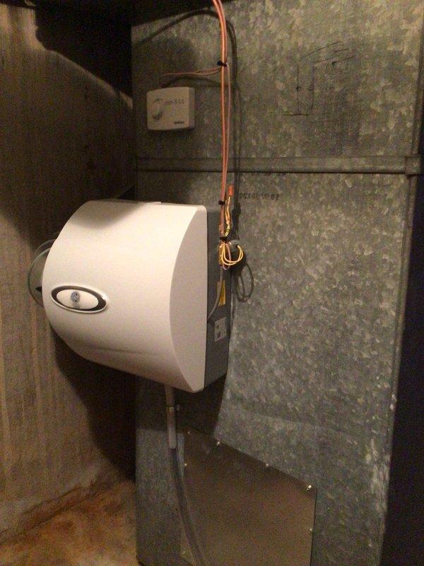 Installed two 600 CFM bypass humidifiers and two APCO-X air purification systems on existing HVAC equipment. All components were properly mounted, connected to ductwork with appropriate fittings, and integrated with the furnace system to provide whole-home humidity control and indoor air quality improvement.