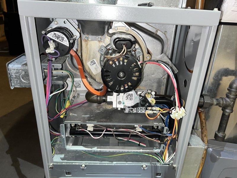 Completed comprehensive tune-up service on residential furnace system located in basement. Performed thorough inspection of blower motor assembly, electrical connections, and control board components. Verified proper voltage readings using digital multimeter to ensure system operating within manufacturer specifications. Cleaned and inspected all internal components including ductwork connections, wiring harnesses, and motor assembly. All safety checks passed and unit returned to normal operation.