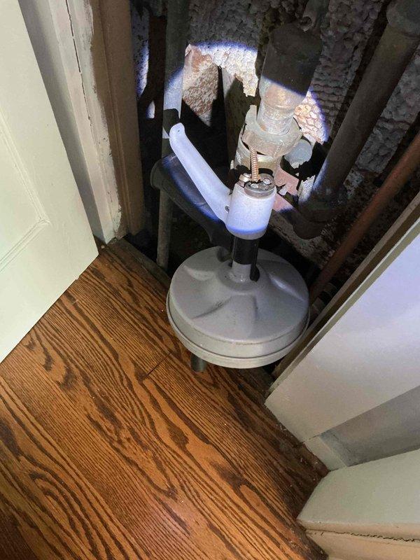 Responded to bathtub/shower drain backup with extremely slow drainage in 1931-era home. Accessed drain system through floor opening and inspected plumbing infrastructure, revealing significant corrosion and deterioration in existing cast iron waste lines. Successfully cleared obstruction and verified proper drainage flow, addressing persistent issue that remained after previous pipe replacement repair.