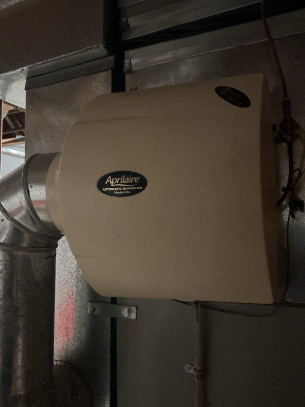 Completed comprehensive heating tune-up on 2024 furnace in basement following recent flood event. Performed full system inspection including burner assembly, heat exchanger, blower motor, and all electrical connections to verify proper operation and ensure no water damage affected furnace performance. Inspected and documented Aprilaire Model 600 humidifier installation and associated ductwork; all components found operating within normal parameters with no moisture-related issues detected.