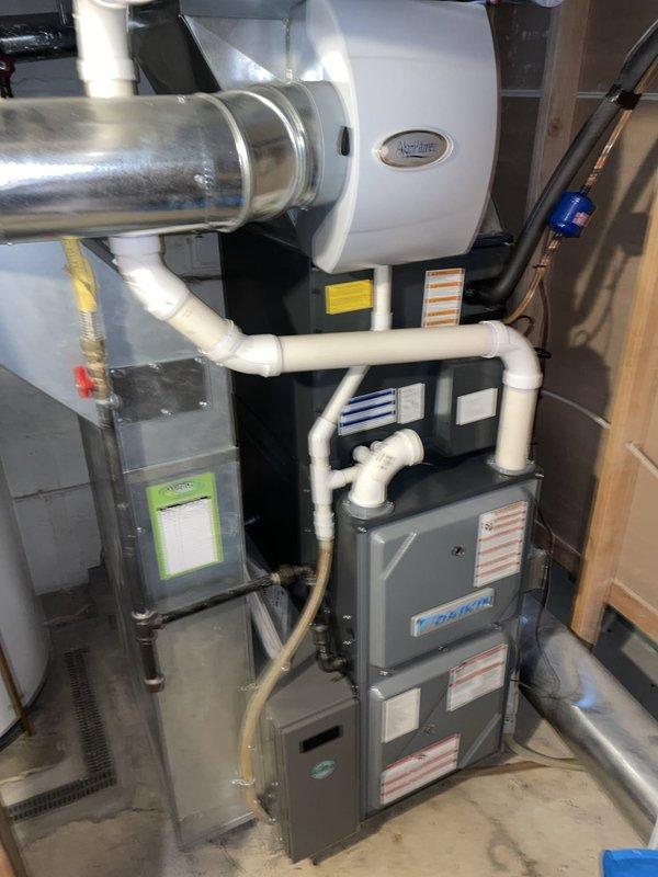 Responded to service call for blank first floor thermostat on 4-year-old residential HVAC system. Upon inspection, diagnosed blown fuse in low-voltage control circuit preventing thermostat operation. Replaced defective fuse with proper amperage automotive-style blade fuse, restoring power to thermostat and normal system function. Verified both heating units operational, tested thermostat display and controls, and confirmed proper communication between thermostat and equipment.
